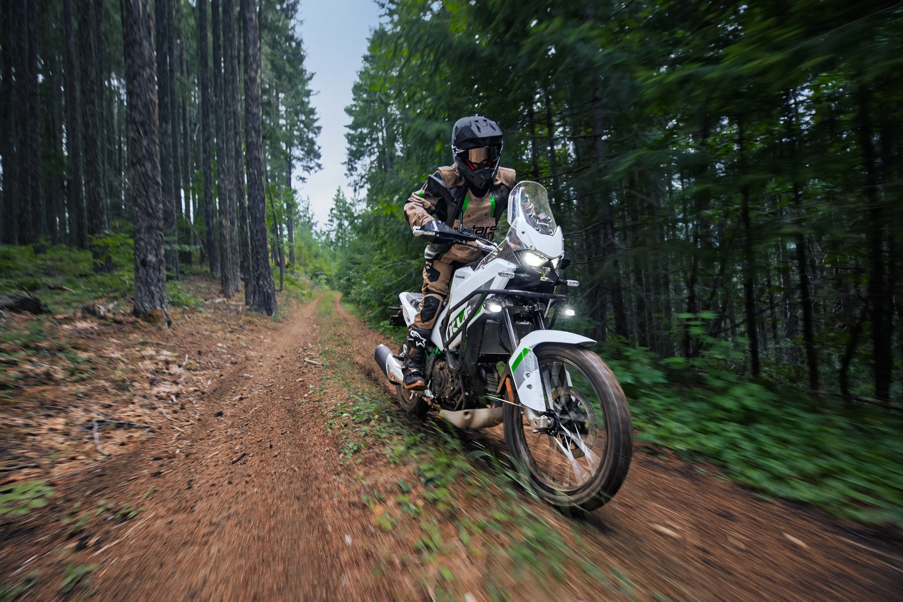 Front angle of a person riding a motorcycle off-road.