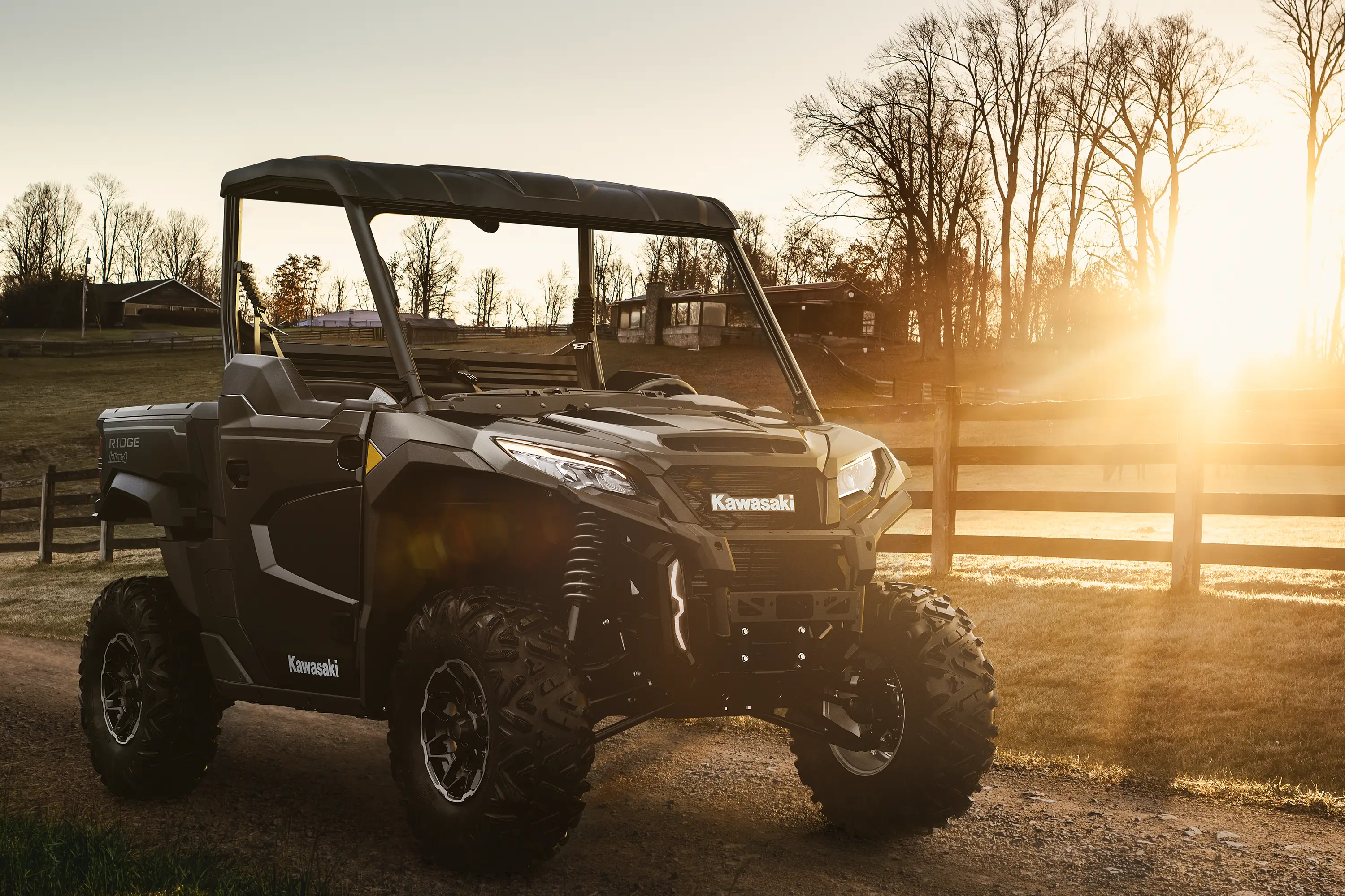 Three-quarter front angle of a side x side parked off-road.