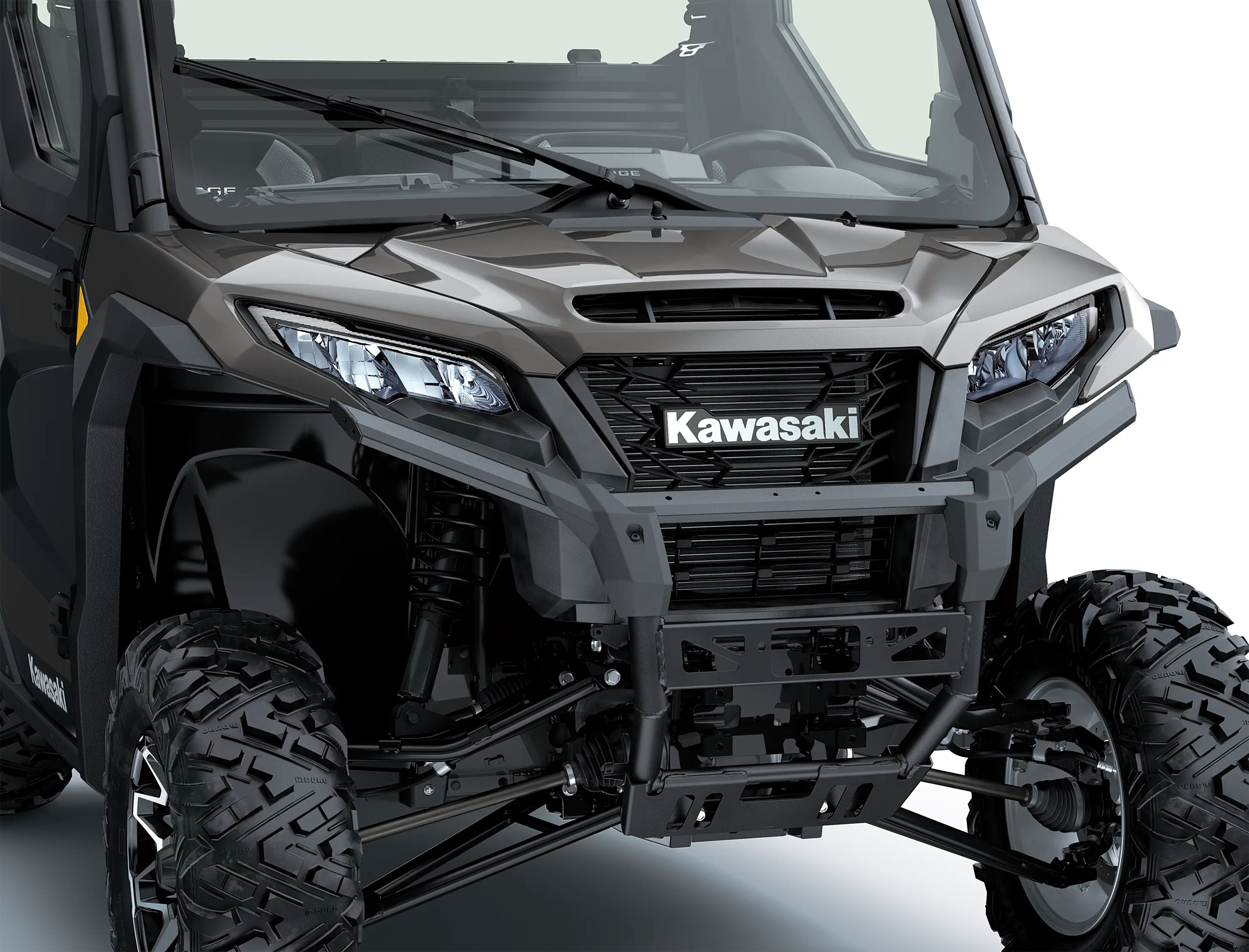 Close-up of the front end of a side x side in a white studio background.