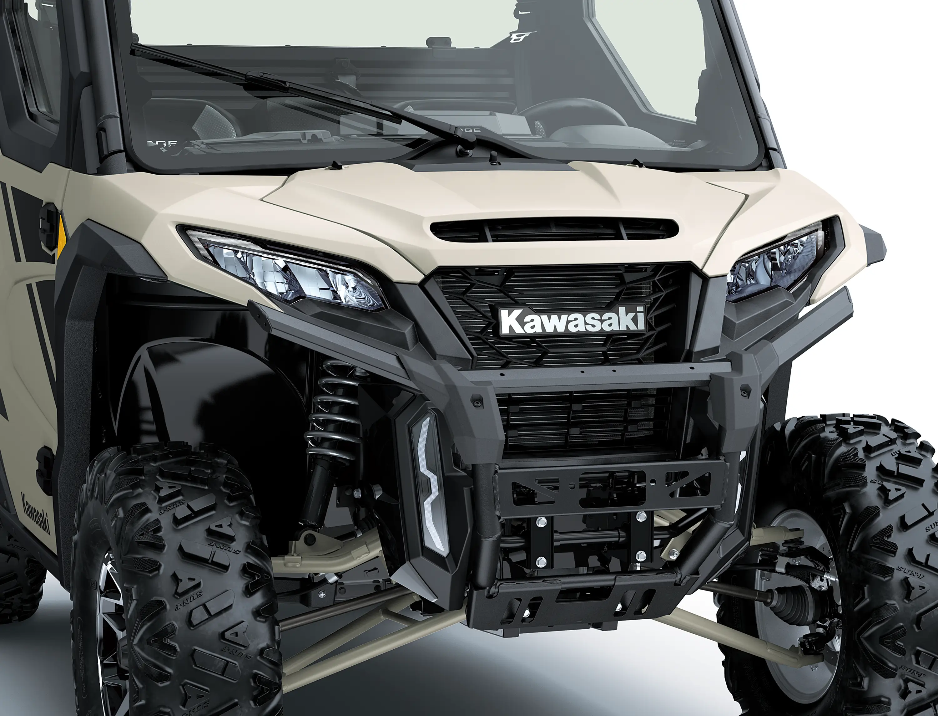 Close-up of the front end of a side x side in a white studio background.