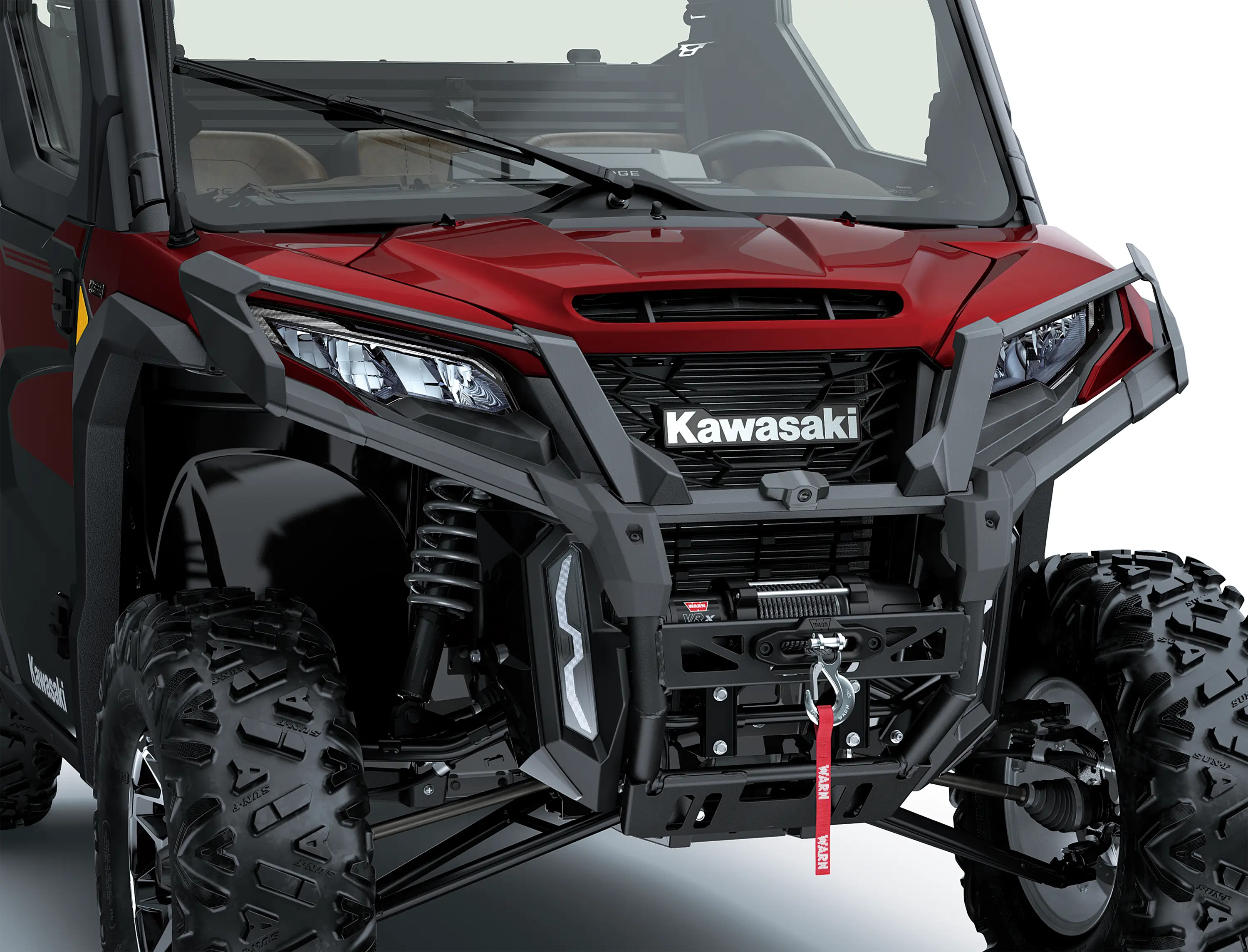 Close-up of the front end of a side x side in a white studio background.