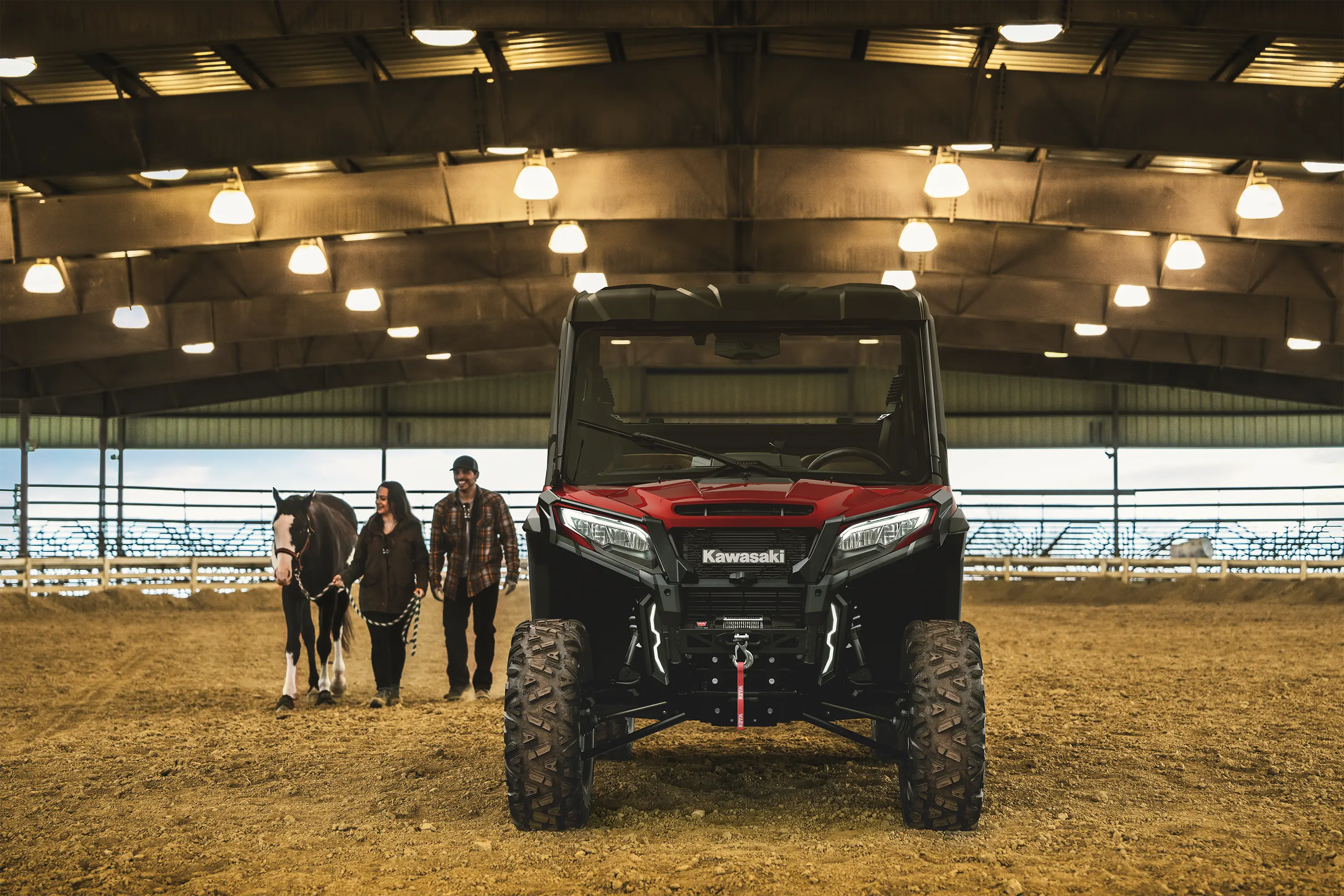 Front angle of a side x side parked in a horse paddock.