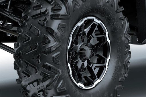 Close-up of wheels of a side x side in a white studio background. opens in a new window