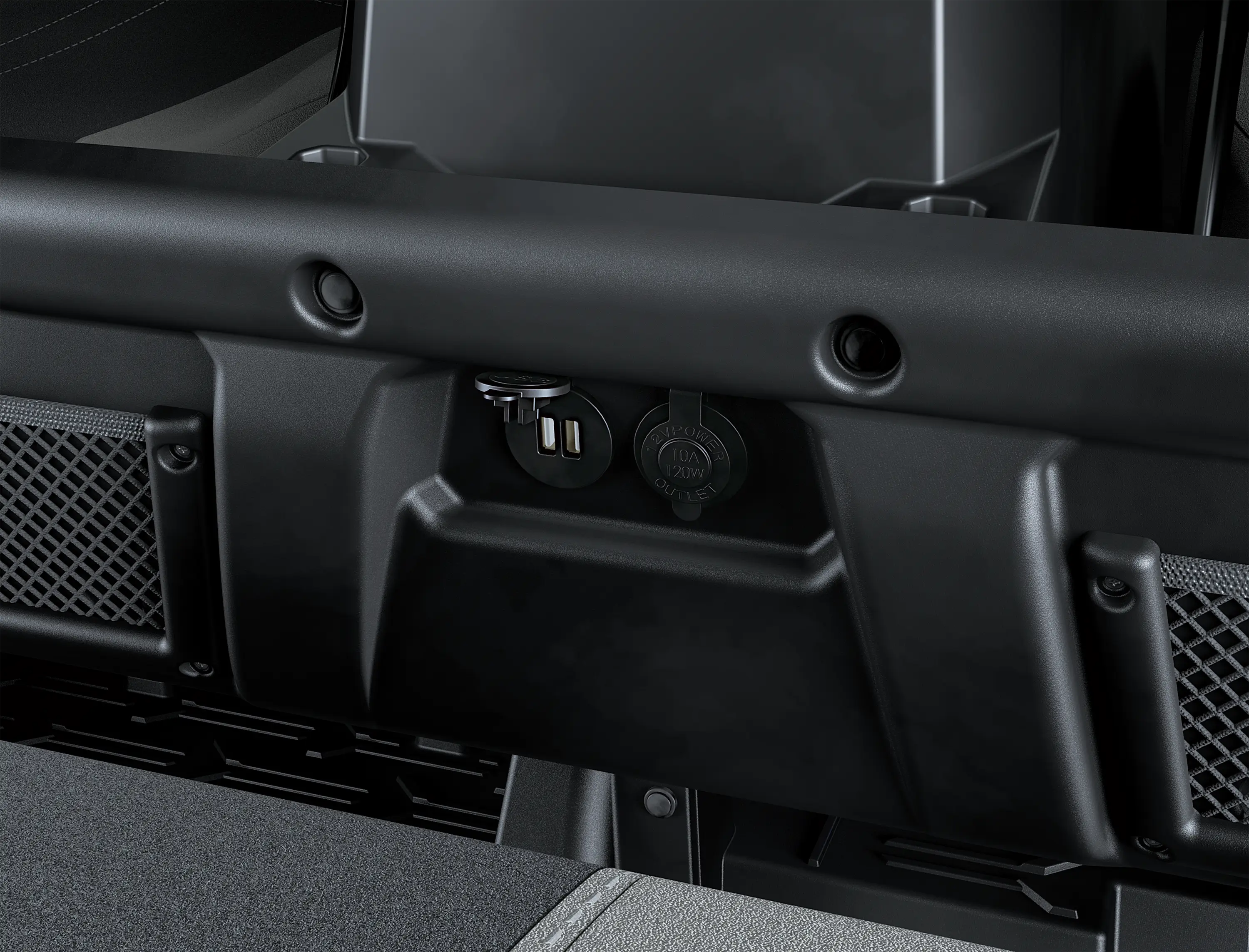 Close-up of USB ports and a 12V power outlet in a side x side.