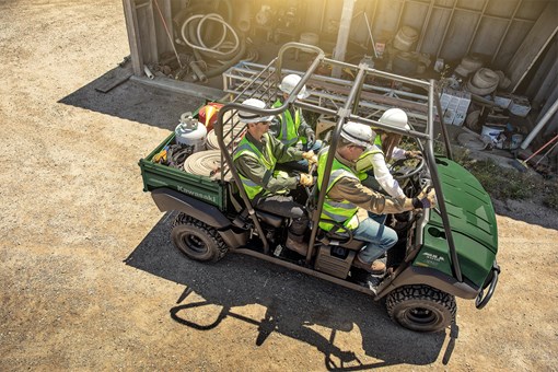 Aerial view of four people driving a side x side off-road. opens in a new window