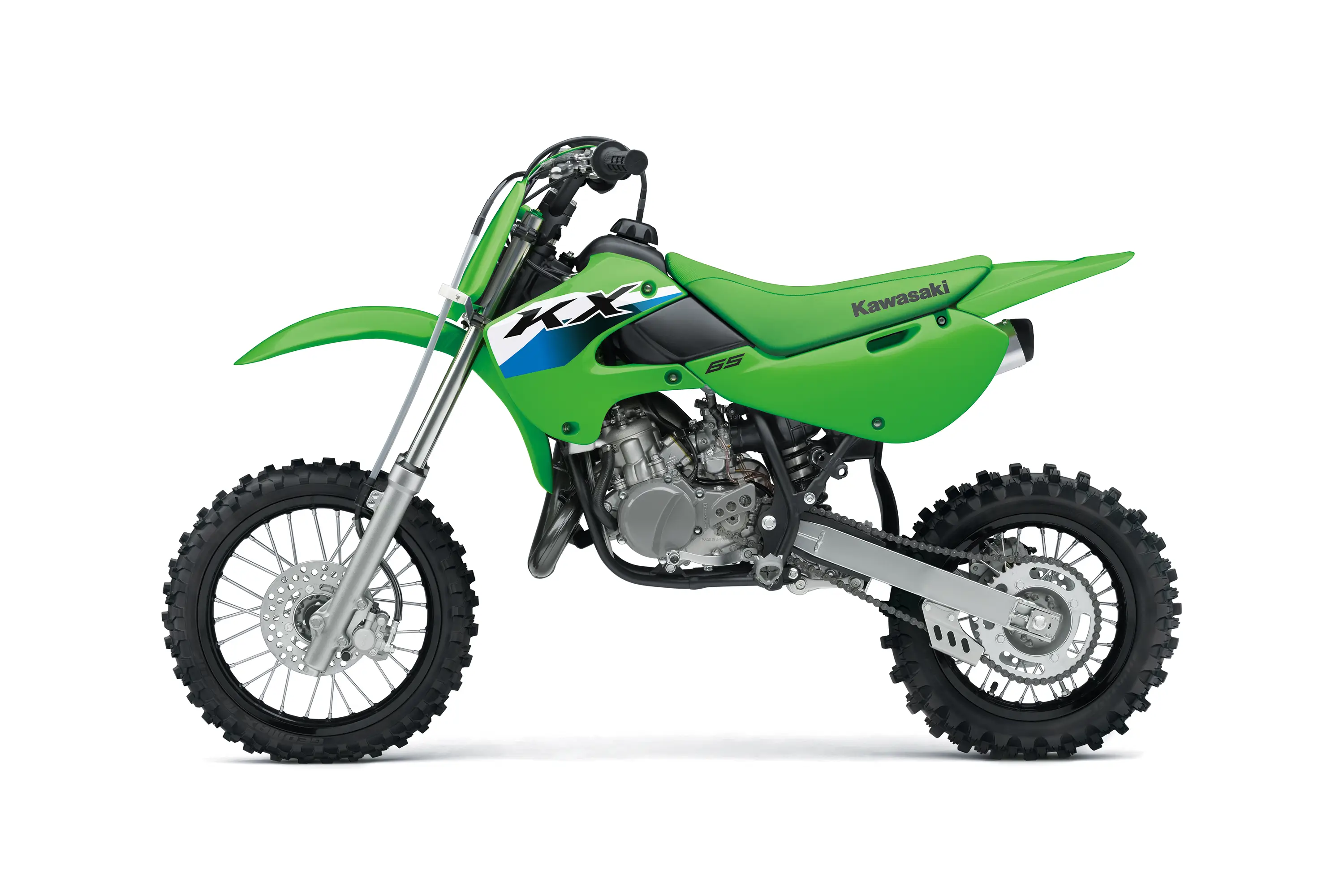 Left side view of a green youth dirt bike in a white studio background.