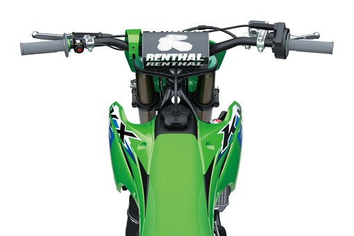 Overhead view of the front end of a dirt bike in a white studio background. opens in a new window