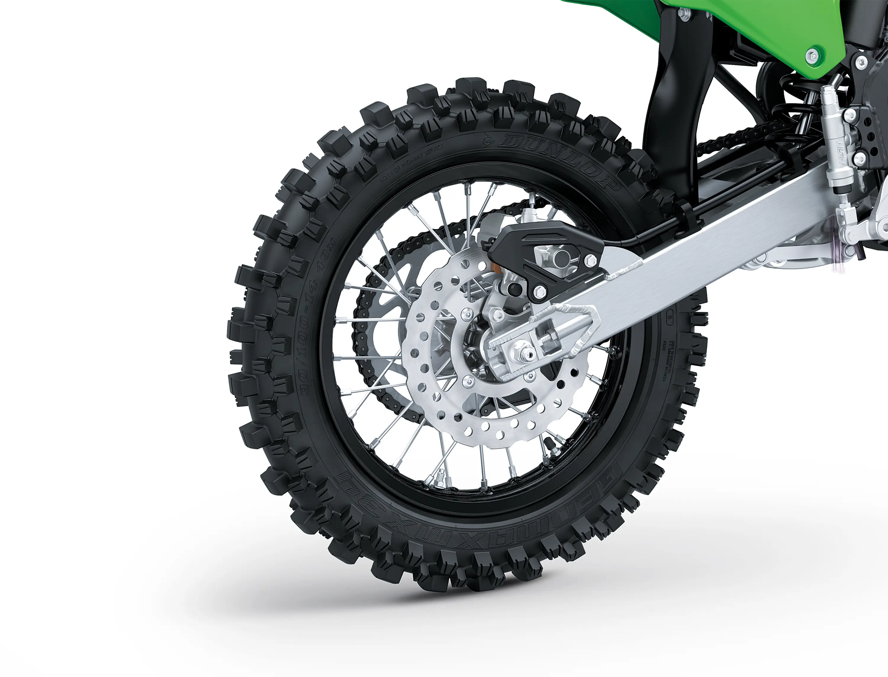 Close up right side view of a dirt bike rear wheel in a white studio background.