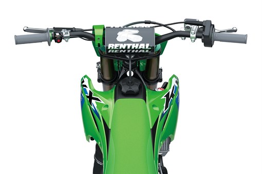 Overhead view of the handlebar and front end of a dirt bike in a white studio background. opens in a new window