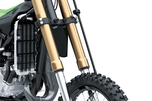 Front three-quarter view of a dirt bike front suspension in a white studio background. opens in a new window