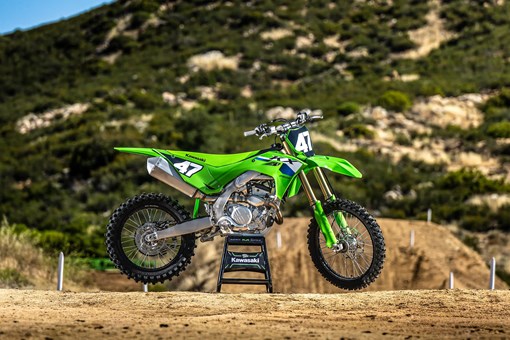 Side angle of a motorcycle staged on a dirt track. opens in a new window