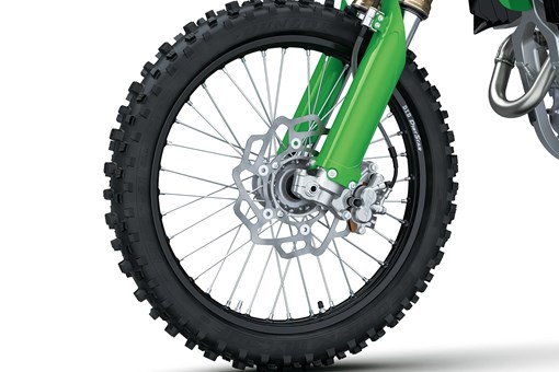 Close-up of the front wheel of a motorcycle staged in a white studio background. opens in a new window