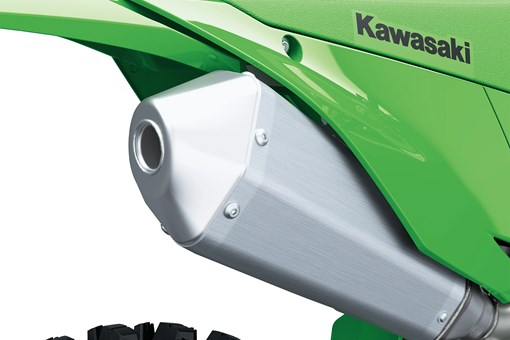 Close-up of the exhaust of a motorcycle staged in a white studio background. opens in a new window