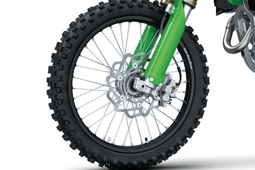 Close-up of the front wheel of a motorcycle staged in a white studio background. opens in a new window