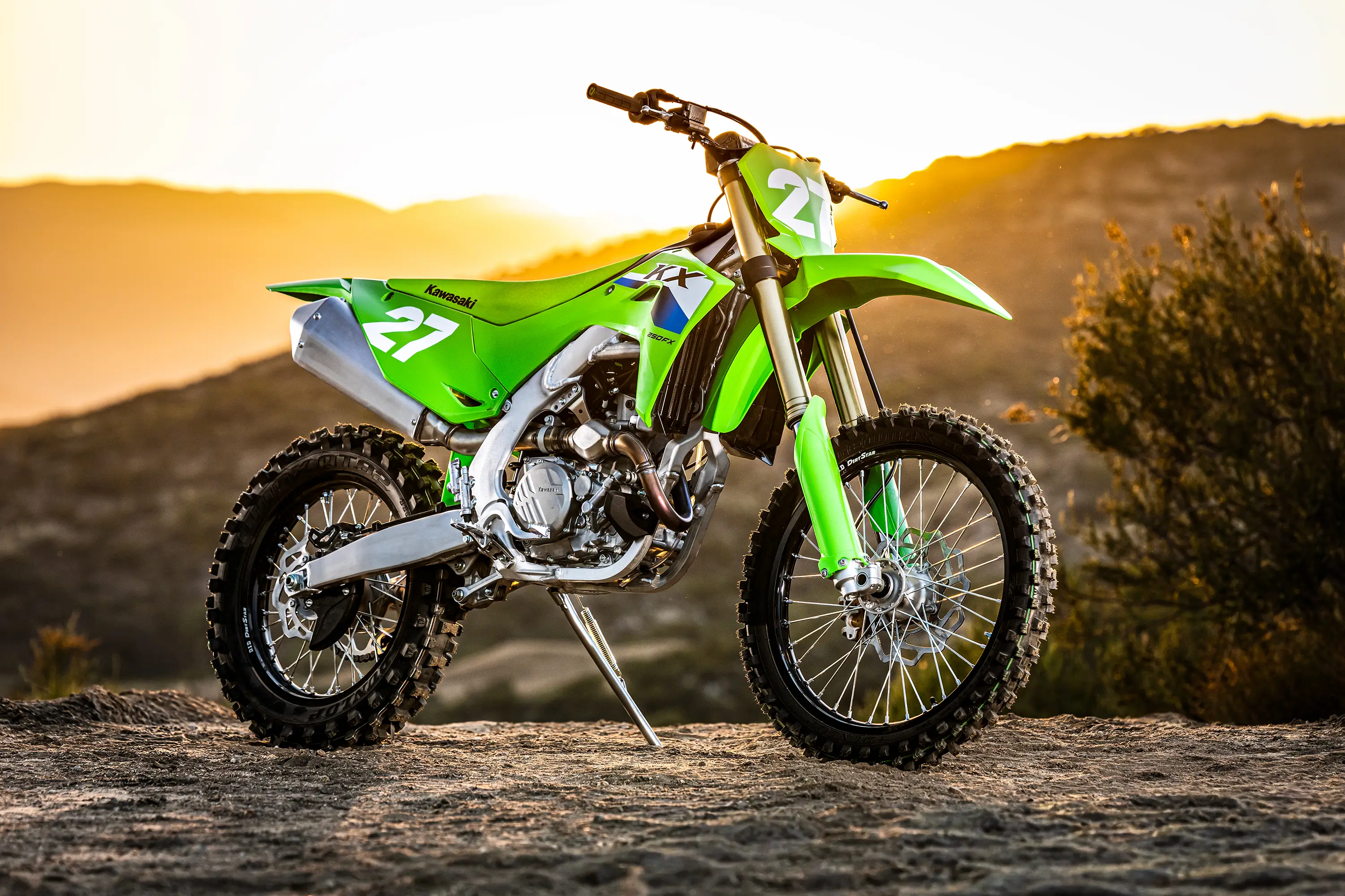 Side angle of a motorcycle staged on a dirt overlook.