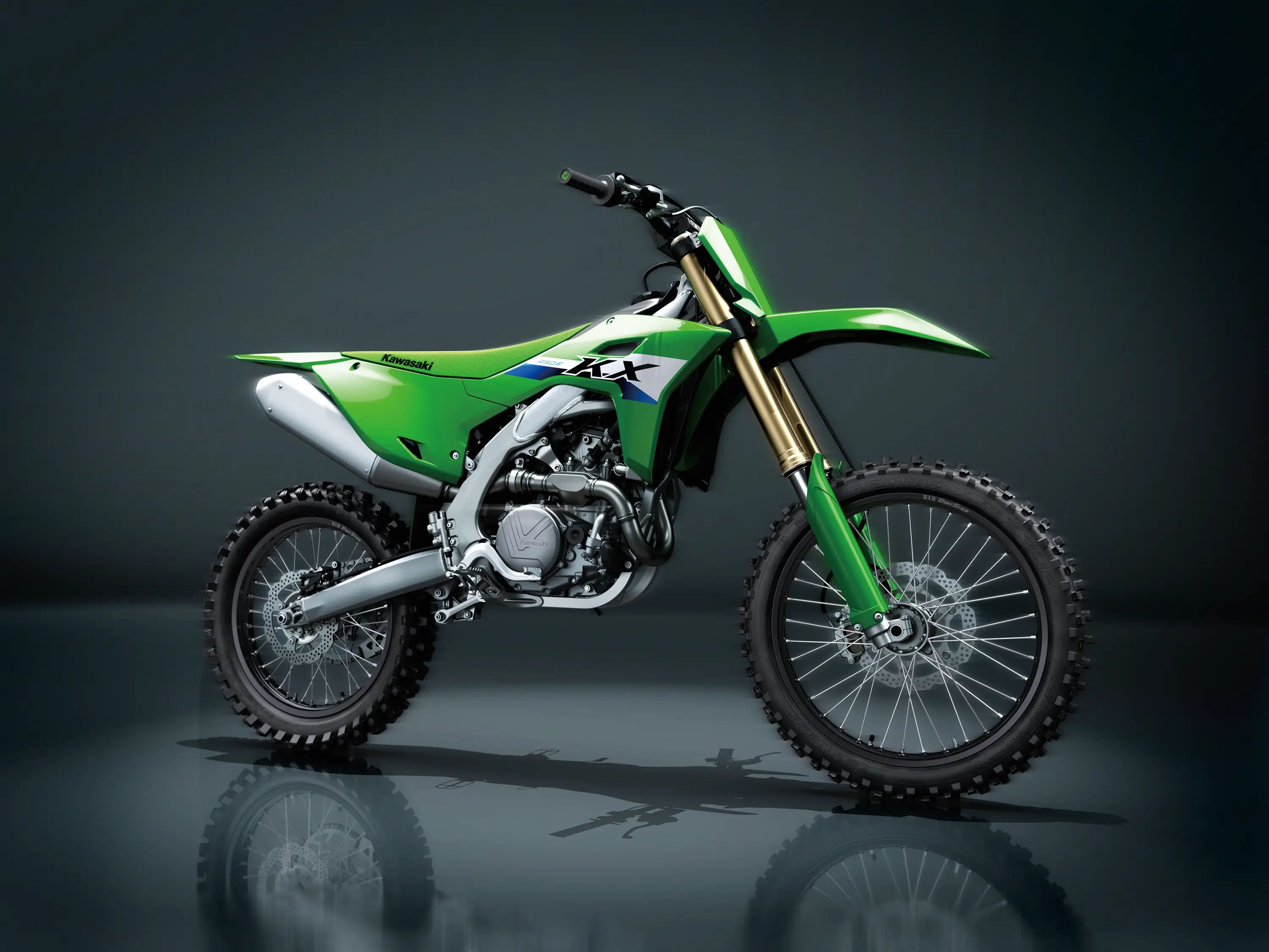 Side view of a motorcycle staged in a black studio background.