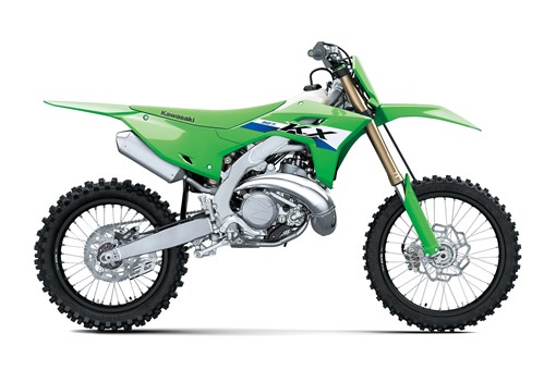 Right side angle of a green 2-stroke dirt bike in a white studio background. opens in a new window
