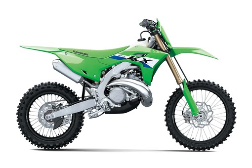 Right side view of a green 2-stroke dirt bike in a white studio background. opens in a new window