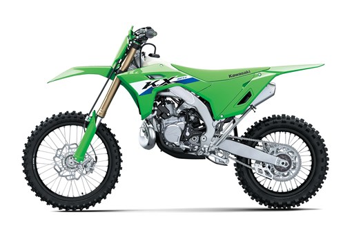 Left side view of a green 2-stroke dirt bike in a white studio background. opens in a new window