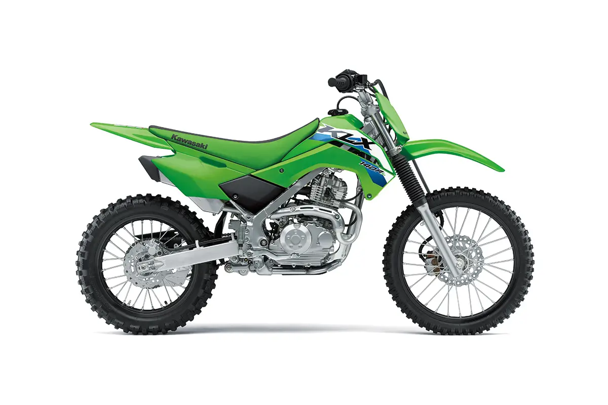 Right side view of a green youth dirt bike staged in a white studio background.