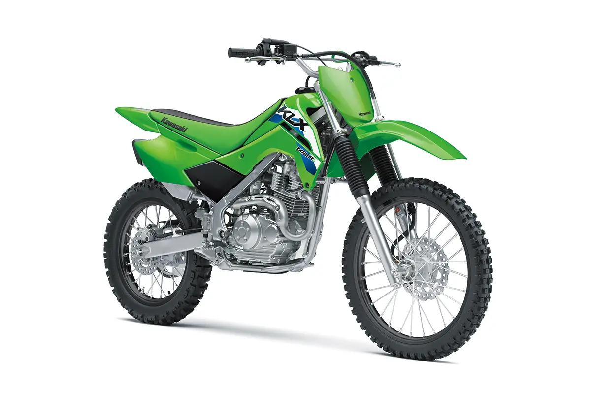 Front three-quarter view of a green youth dirt bike in a white studio background.