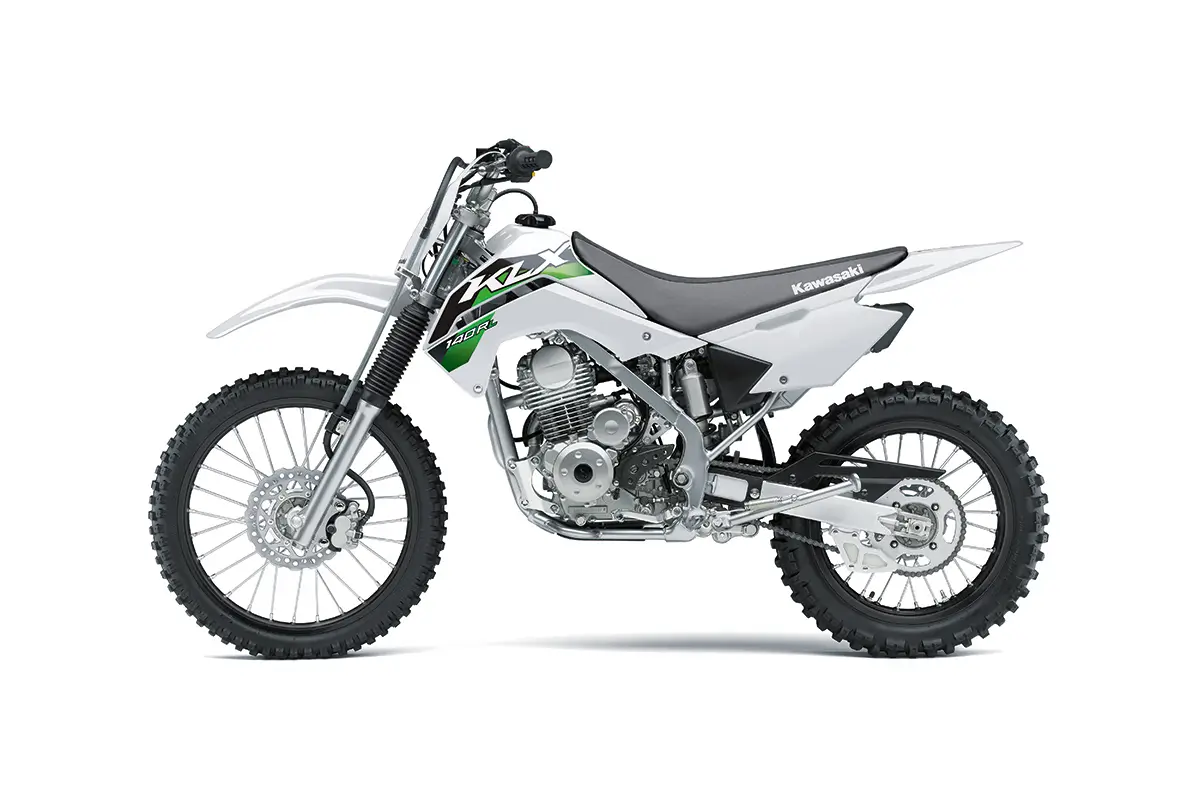 Left side view of a white youth dirt bike staged in a white studio background.