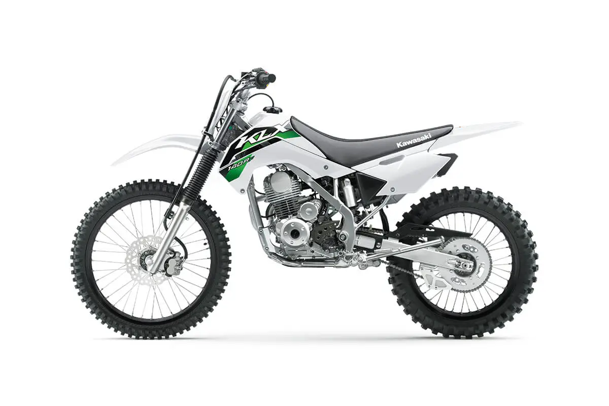Left side view of a white dirt bike staged in a white studio background.
