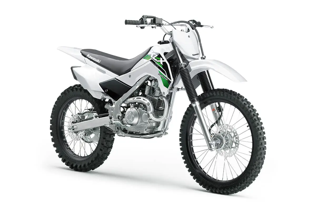 Front three-quarter view of a white dirt bike in a white studio background.