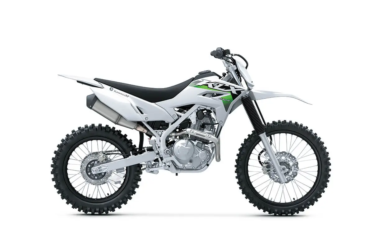 Side angle of a silver motorcycle staged in a white studio background.