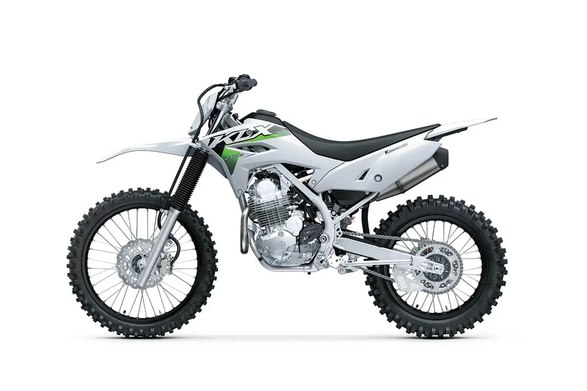 Side angle of a silver motorcycle staged in a white studio background.