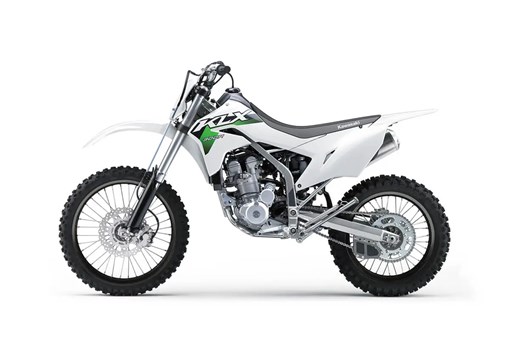 Left side view of a white dirt bike staged in a white studio background. opens in a new window