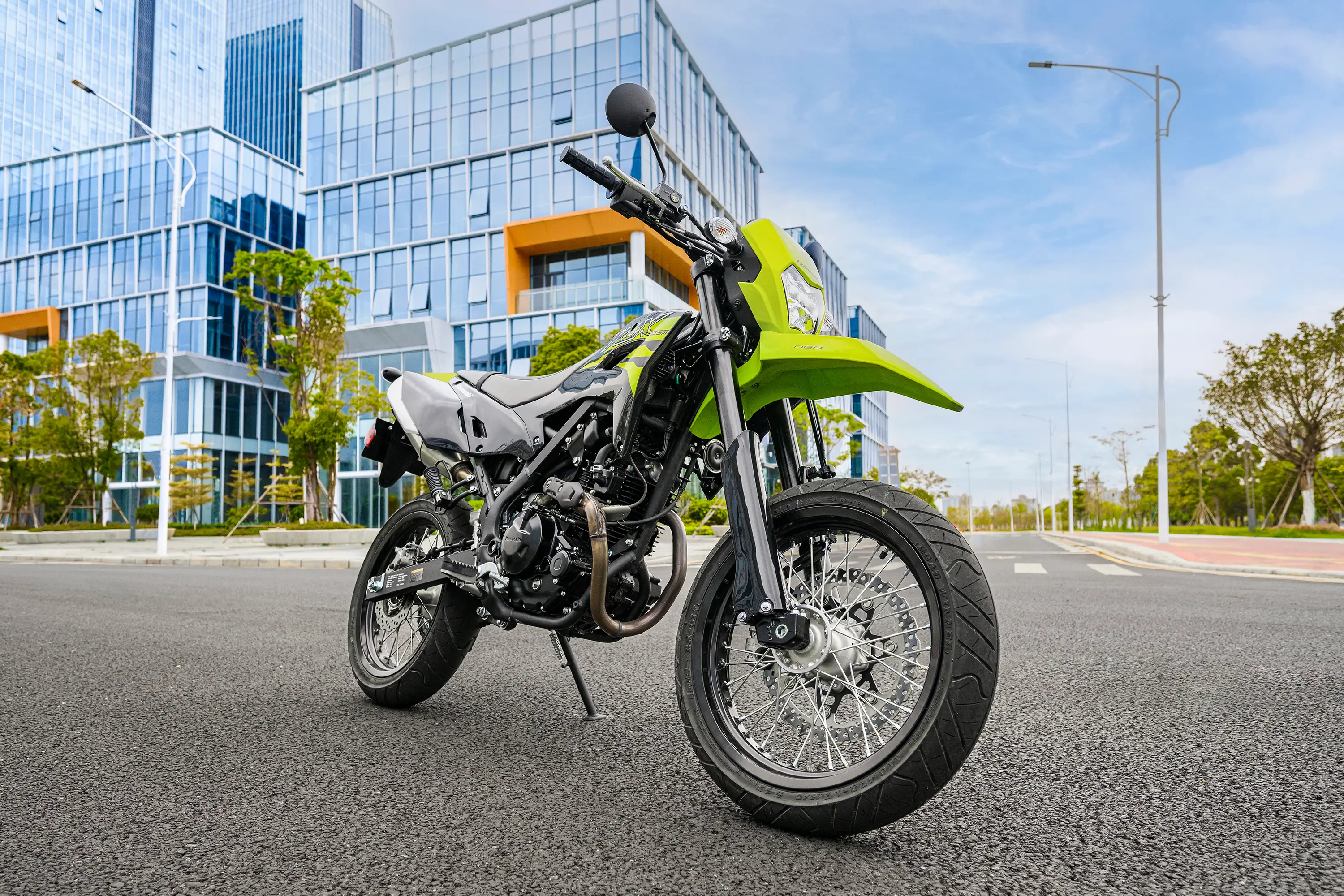 Three-quarter front angle of a motorcycle staged on a city street.