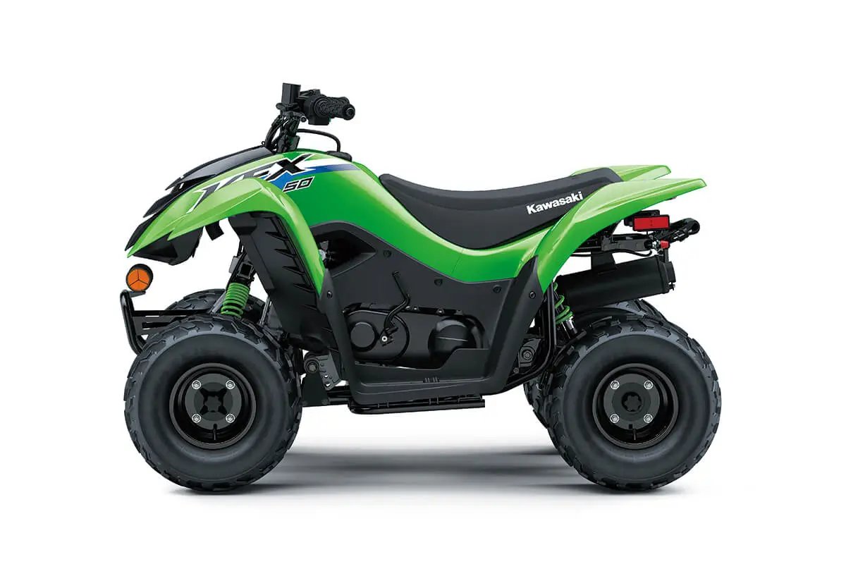 Left side view of a green youth ATV staged in a white studio background.
