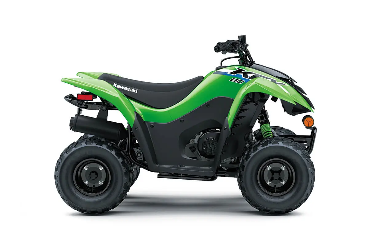 Right side view of a green youth ATV staged in a white studio background.