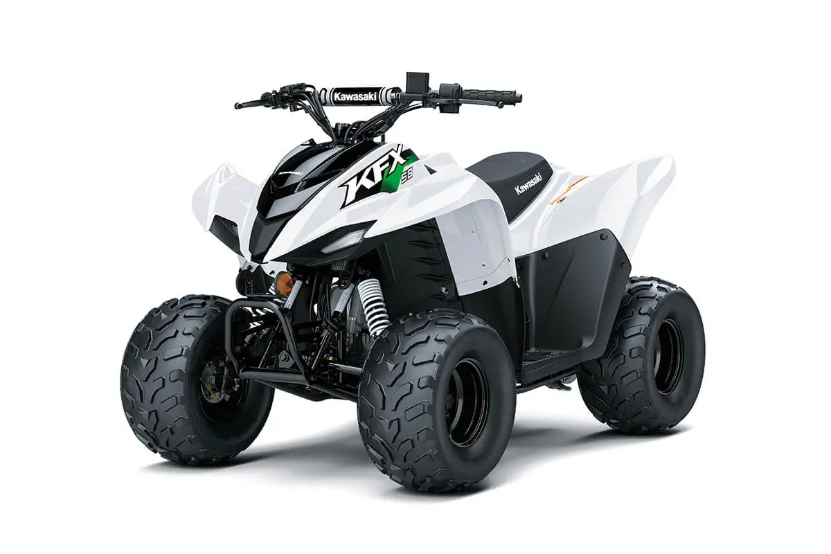 Front three-quarter view of a green youth ATV in a white studio background.