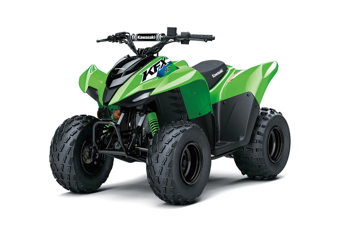 Front three-quarter view of a green youth ATV in a white studio background.