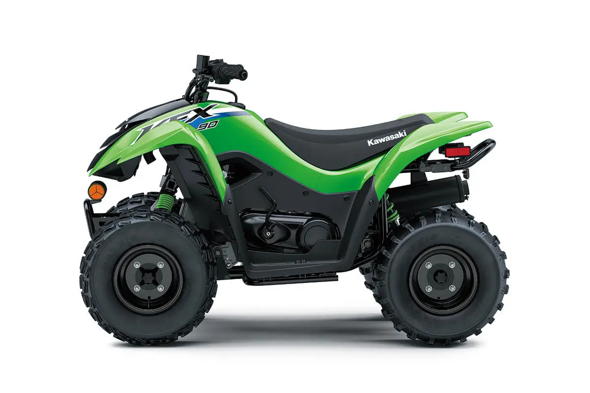 Left side view of a green youth ATV staged in a white studio background.