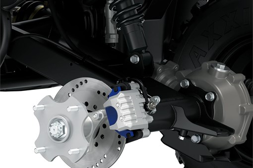 Detail view of the rear brakes of a utility ATV in a white studio background. opens in a new window
