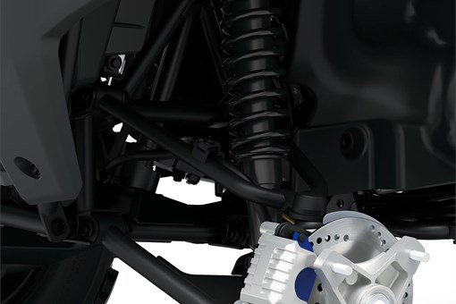 Detail view of the front brake of a utility ATV in a white studio background. opens in a new window