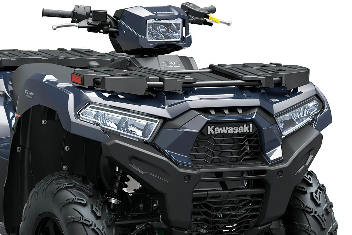 Detail view of the front end and grille of a utility ATV in a white studio background.