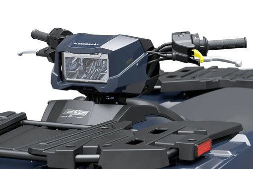 Detail view of the headlight of a utility ATV staged in a white studio background. opens in a new window