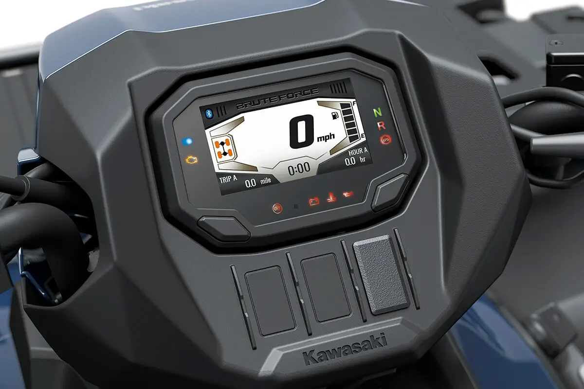 Detail view of a digital dash on a utility ATV in a white studio background.