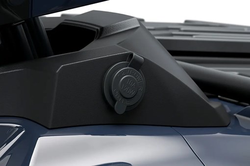 Detail view of a 12v outlet on a utility ATV in a white studio background. opens in a new window