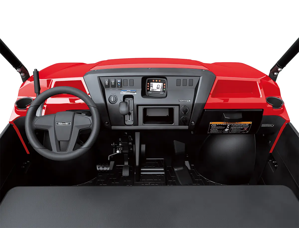 Detail view of the dashboard of a red side x side staged in a white studio background.