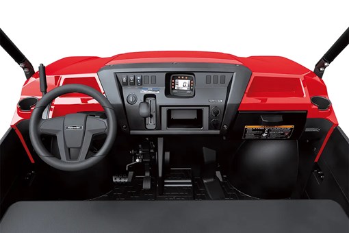 Detail view of the dashboard of a red side x side staged in a white studio background. opens in a new window