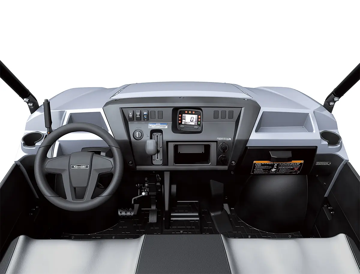 Detail view of the dashboard of a side x side staged in a white studio background.