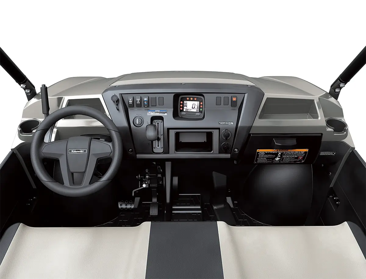 Detail view of the dashboard of a side x side staged in a white studio background.