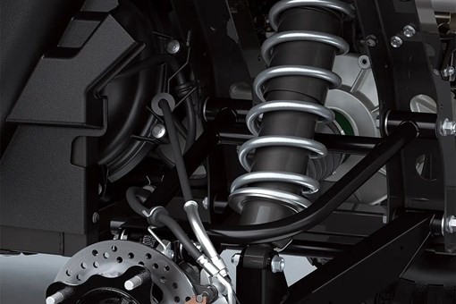 Detail view of the rear suspension of a side x side in a white studio background. opens in a new window
