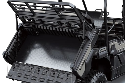 Cargo bed of a side x side in the tilt position staged in a white studio background. opens in a new window