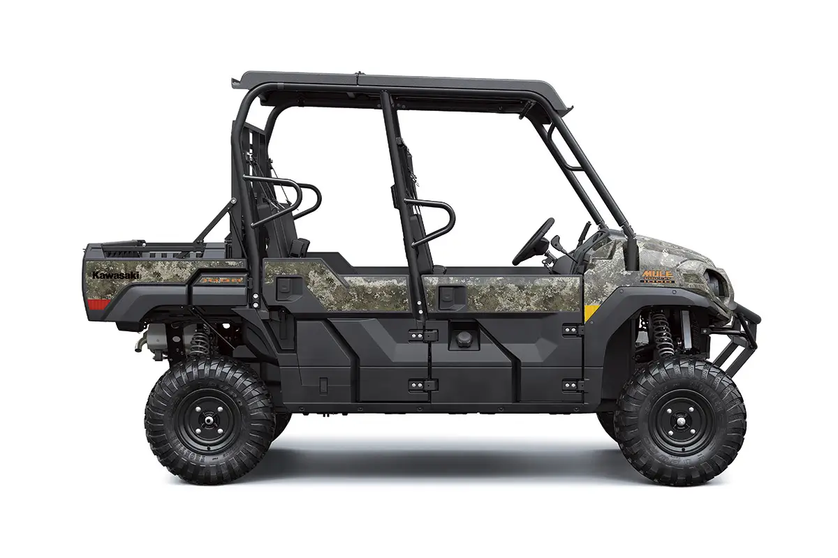 Right side view of a camo side x side staged in a white studio background.